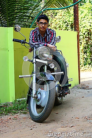 Young Male Indian on a Big Black Bike