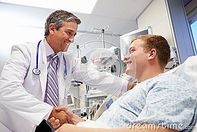 Young Male Patient Talking To Doctor In Emergency Room