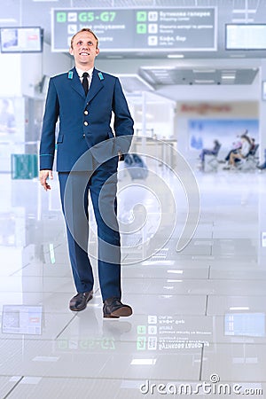 Young man in aircraft service uniform in airport area