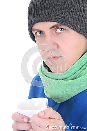 Young man in blue sweater and green scarf with cu