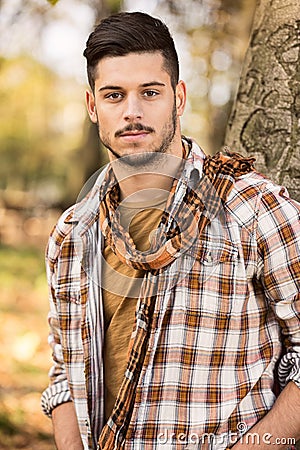 Young man in a checkered shirt