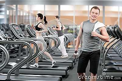 Young man in fitness club