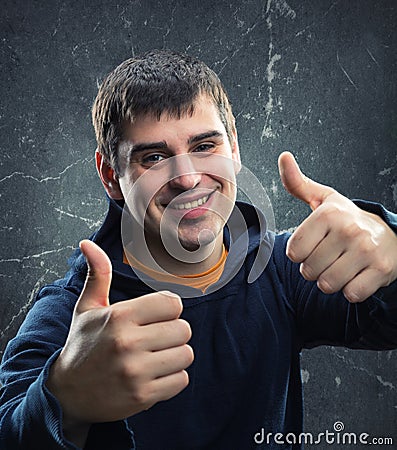 Young man giving thumb up