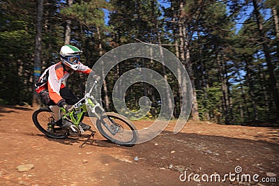 Young man with a helmet riding a mountain bike
