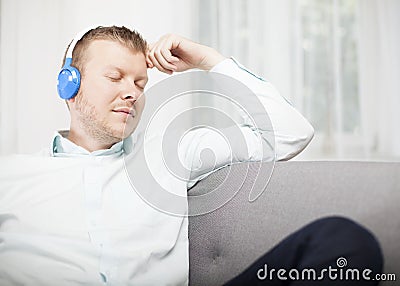 Young man relaxing listening to music