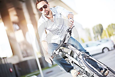 Young man riding a bicycle