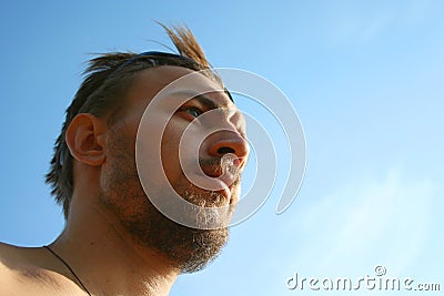 Young man with the sky above