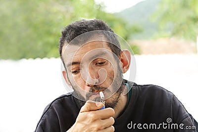 Young man smoking a cigarette