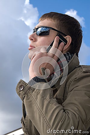 Young man speaks on the phone