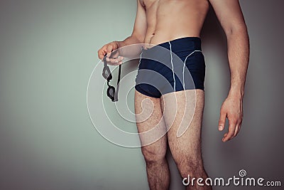 Young man in swimming trunks