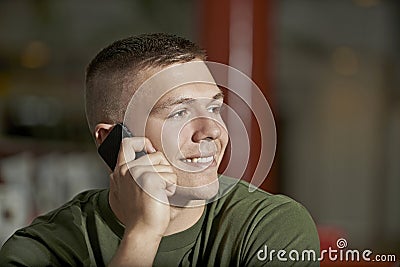 Young man talking on smartphone