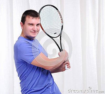 Young man with tennis racket