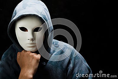 Young man wearing white mask and hood