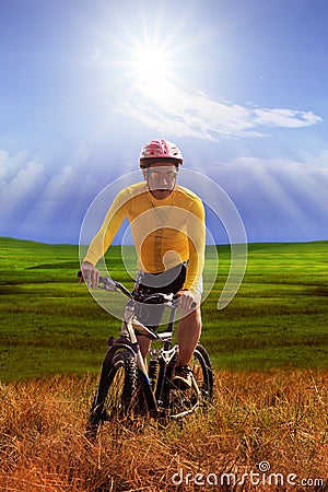 Young man wearing yellow bicycle shirt riding mountain bike mtb