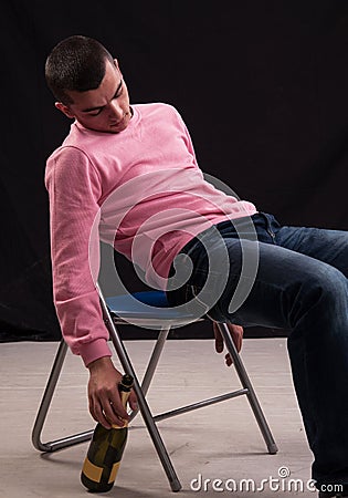 Young man who drank wine, fell asleep in the chair
