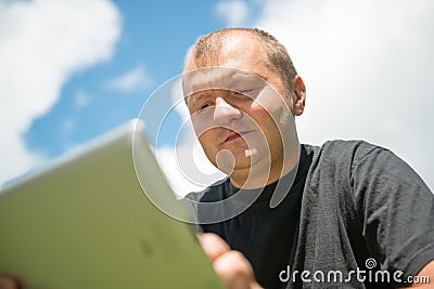 Young man working with ipad (tablet computer)