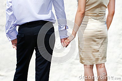 Young married couple holding hands