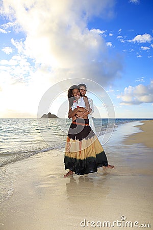 Young mixed race couple at the beach