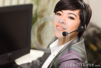 Young Mixed Race Woman Smiles Wearing Headset