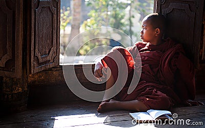 Young monk learning in monastery Myanmar