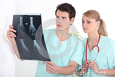 Young nurses looking at an x-ray