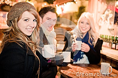 Young People drinking Punch at Christmas Market