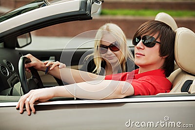 Young people driving a car