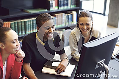 Young people enjoying studying in library