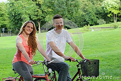 Young people with their bikes in a park