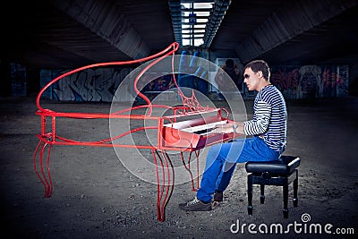 Young pianist play on his piano with bright emotions,