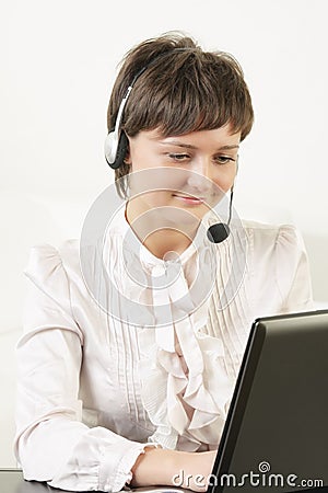 Young positive woman in headset
