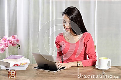 Young pretty woman work in home office