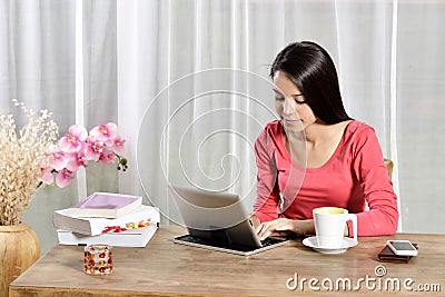 Young pretty woman work in home office