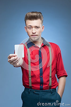 Young retro man holding empty card