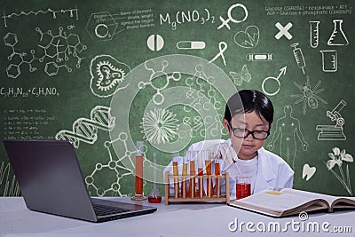 Young scientist with chemical fluid