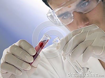 Young scientist working with mask