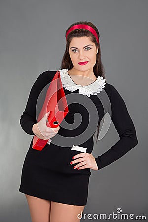 Sexy teacher with red folder over grey