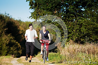 http://thumbs.dreamstime.com/x/young-sport-couple-jogging-cycling-12738645.jpg