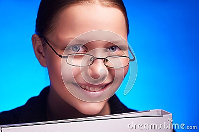 Young student in eyeglasses holds folder and smiling