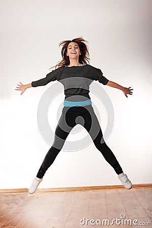 Young stylish woman dancing modern dance