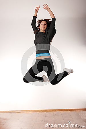 Young stylish woman dancing modern dance