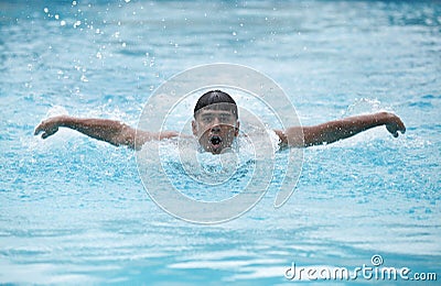 A young swimmer performing butterfly stroke
