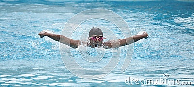 A young swimmer in swimming pool