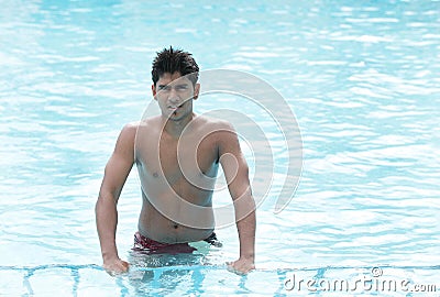 A young swimmer in swimming pool