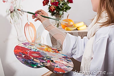 Young talented woman painting