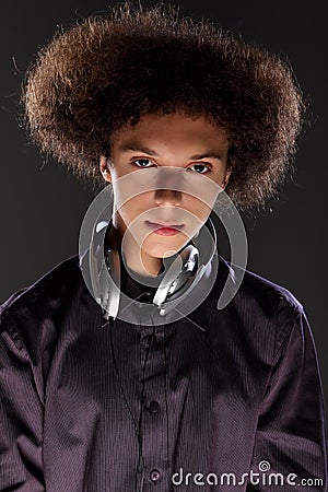 Young teenager man music DJ with afro hairstyle