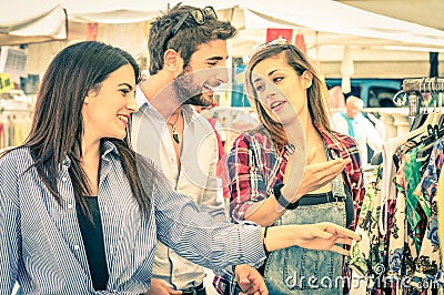 Young tourists at the weekly cloth market - Best friends concept