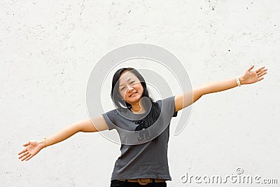 Young woman with arms wide open