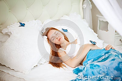 Young woman in bed in the morning