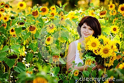 Young woman with a bouquet of sunflowers